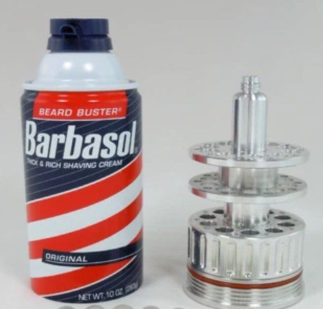 Barbasol shaving cream can next to a mechanical device.